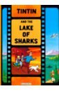 Herge Tintin and the Lake of Sharks the phonetic version of the four famous works genuine original extracurricular reading books for students in grades 1 4 libros