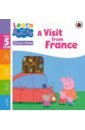 A Visit from France. Level 5 Book 6 jolly phonics workbook 6 in precursive letters